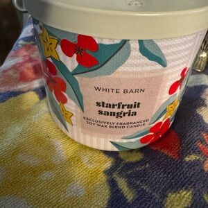 White Barn Starfruit Sangria Candle with Red and Yellow Floral Design